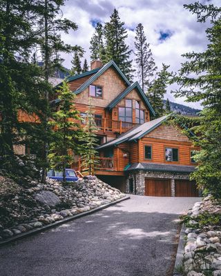 A beautifully finished cabin house in the woods.